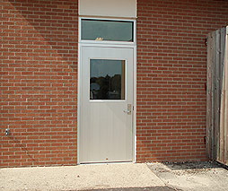installed aluminum plank door with single half light entry